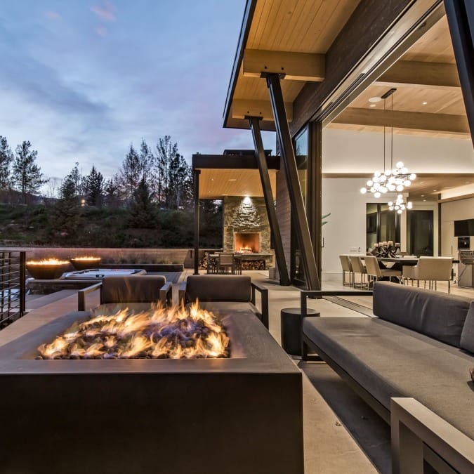 Indoor/Outdoor Living with Bi-Fold Sliding Doors and Fire Table