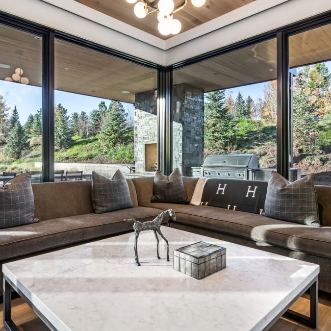Cornered Sitting Area Looking Out Onto An Outdoor Kitchen