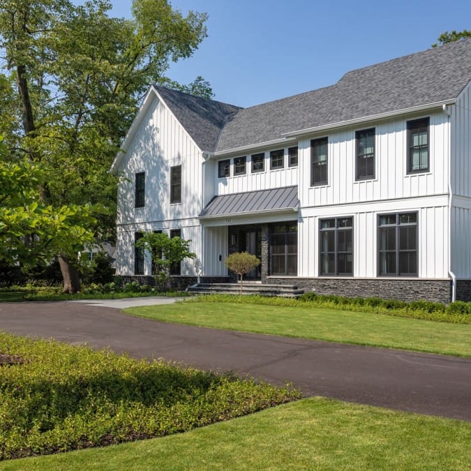 Exterior of Home Featuring Natural Stone, Board and Batten Siding Exterior of Home Featuring Natural Stone, Board and Batten Siding