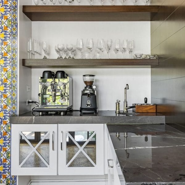 Custom Coffee Station with Floating Shelves and Glass Front Cabinets