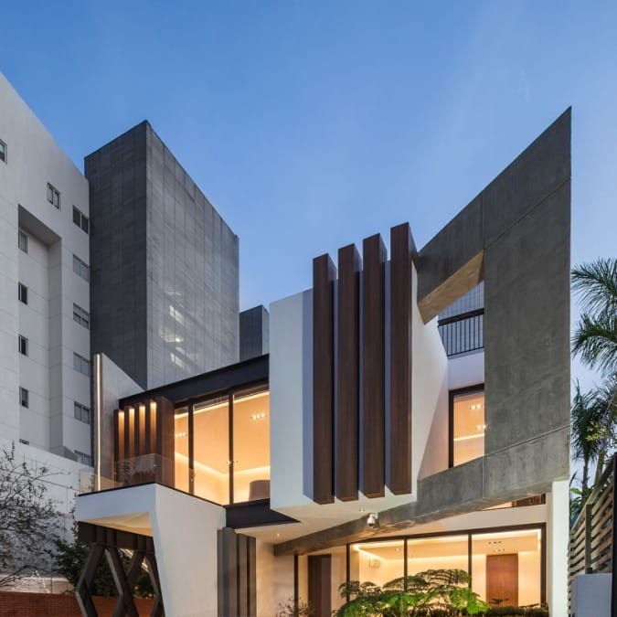 Covered Entryway with Glassed-In Balcony Above